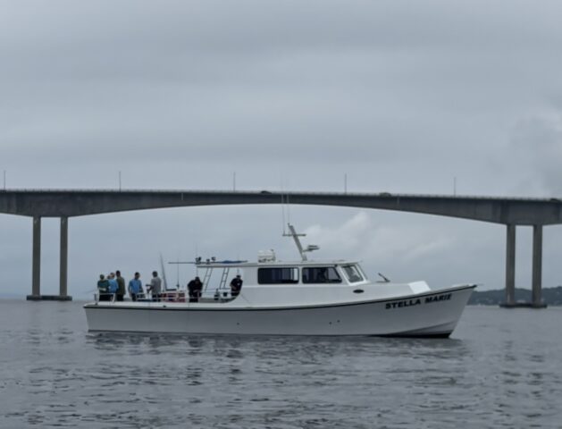 Stella Marie fishing boat in front of Newport Bridge